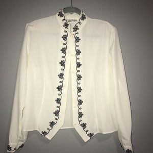 white blouse with black accents